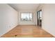 Living room with light wood floors, a large window and sliding glass door at 5303 N 7Th St # 242, Phoenix, AZ 85014