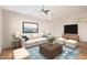 Bright and airy living room with neutral tones, plush seating, modern decor, and ample natural light at 5303 N 7Th St # 242, Phoenix, AZ 85014