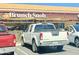 Front view of a Brunch Snob parking lot with a white truck and a glimpse of the restaurant at 5303 N 7Th St # 242, Phoenix, AZ 85014