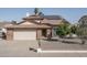 Charming single-Gathering home featuring a brick facade, solar panels, and a well-manicured front yard at 5434 W Desert Hills Dr, Glendale, AZ 85304