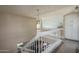 Loft area featuring a white railing overlooking the living room at 5434 W Desert Hills Dr, Glendale, AZ 85304