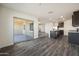 Spacious open floor plan featuring a kitchen with an island and sliding doors to a covered patio at 611 W Crowned Dove Trl, Casa Grande, AZ 85122