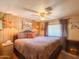 Cozy bedroom with a plush bed, ceiling fan, and warm lighting at 661 N Hawes Rd # 34, Mesa, AZ 85208