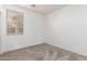 Neutral carpeted bedroom with a bright window, perfect for personalization at 702 S 119Th Ave, Avondale, AZ 85323