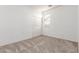 Comfortable bedroom with carpet flooring, closet with white doors, and a window at 702 S 119Th Ave, Avondale, AZ 85323