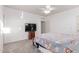 Calm main bedroom with neutral tones, ceiling fan, and closet space for storage at 702 S 119Th Ave, Avondale, AZ 85323