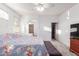 Spacious main bedroom with a view into the ensuite bathroom and walk-in closet at 702 S 119Th Ave, Avondale, AZ 85323