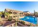 Sparkling backyard pool with desert landscaping, covered patio, and privacy at 702 S 119Th Ave, Avondale, AZ 85323