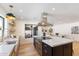 Bright, modern kitchen with an island, stainless steel appliances, and marble countertops at 7553 E Woodshire Cv, Scottsdale, AZ 85258