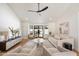 Spacious living room with vaulted ceilings, hardwood floors, and modern furnishings at 7553 E Woodshire Cv, Scottsdale, AZ 85258