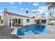Beautiful backyard showcasing pool, patio, and outdoor dining area at 7553 E Woodshire Cv, Scottsdale, AZ 85258