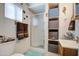 Functional bathroom with a walk-in shower and storage shelves at 7750 E Broadway Rd # 475, Mesa, AZ 85208