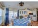 Cozy dining area with a round table, blue accents, and sliding door access to the outdoors at 7750 E Broadway Rd # 475, Mesa, AZ 85208