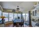 Charming dining area with a round table, large windows, and access to the outdoors at 7750 E Broadway Rd # 475, Mesa, AZ 85208