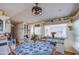Comfortable dining area with a round table, bright windows, and built in storage at 7750 E Broadway Rd # 475, Mesa, AZ 85208