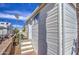 A charming manufactured home with white siding, a small front patio, and a meticulously landscaped yard at 7750 E Broadway Rd # 475, Mesa, AZ 85208