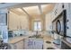 Bright kitchen with white cabinets, modern appliances, and ample counter space for cooking at 7750 E Broadway Rd # 475, Mesa, AZ 85208