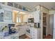 Bright kitchen featuring white cabinets, modern appliances, and a cozy breakfast nook with natural light at 7750 E Broadway Rd # 475, Mesa, AZ 85208