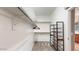 Walk-in closet features carpeted floors, metal shelving, and clothes racks at 8385 W Vogel Ave, Peoria, AZ 85345
