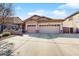 Attractive single-story home with a large driveway and a well-maintained front yard at 8385 W Vogel Ave, Peoria, AZ 85345