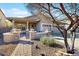 Inviting single-story home featuring a charming front porch and a well-maintained landscape at 8385 W Vogel Ave, Peoria, AZ 85345