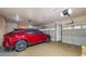 A three car garage features epoxy floors and plenty of storage space at 8385 W Vogel Ave, Peoria, AZ 85345