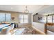 Open-concept kitchen area with a center island, modern light fixture, and sleek countertops at 8385 W Vogel Ave, Peoria, AZ 85345