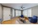 Inviting living room featuring natural light, tile floors, shuttered windows, and comfortable seating at 8385 W Vogel Ave, Peoria, AZ 85345