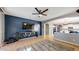Stylish living room features a navy accent wall, tile flooring, and an open layout at 8385 W Vogel Ave, Peoria, AZ 85345