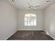 Bedroom with large window, ceiling fan and neutral colored carpet at 8514 E Krail St, Scottsdale, AZ 85250