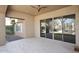 Covered patio with tile flooring, ceiling fan, and view of landscaped yard at 8514 E Krail St, Scottsdale, AZ 85250