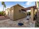 Spacious backyard with a pergola, cornhole, and patio, perfect for outdoor activities at 8737 E San Vicente Dr, Scottsdale, AZ 85258