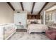 Charming bedroom with beamed ceiling, a crib, and a cozy window seat perfect for a Bedroom at 8737 E San Vicente Dr, Scottsdale, AZ 85258