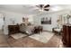 This cozy bedroom features tile floors, a ceiling fan, and unique Southwestern decor at 8737 E San Vicente Dr, Scottsdale, AZ 85258