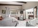 Bright bedroom with a large window seat, neutral tones, and adjoining room at 8737 E San Vicente Dr, Scottsdale, AZ 85258
