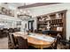 Elegant dining room featuring a decorative chandelier and custom-built bar with glassware and liquor storage at 8737 E San Vicente Dr, Scottsdale, AZ 85258