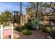 Home exterior with desert landscaping, a well-manicured lawn, and a 'For Sale' sign at 8737 E San Vicente Dr, Scottsdale, AZ 85258