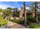 Home exterior featuring lush landscaping, desert plants, and a well-manicured walkway at 8737 E San Vicente Dr, Scottsdale, AZ 85258