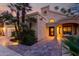 Stunning single-Gathering home exterior highlighting stone walkway, desert landscaping, and covered entrance with bench seating at 8737 E San Vicente Dr, Scottsdale, AZ 85258