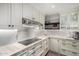 Well-appointed kitchen with modern appliances, mosaic backsplash, and ample counter space at 8737 E San Vicente Dr, Scottsdale, AZ 85258