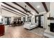Open-concept living area with beamed ceilings, wood floors, and plenty of space for dining and relaxation at 8737 E San Vicente Dr, Scottsdale, AZ 85258