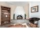 Cozy living room with a unique corner fireplace and Southwestern decor at 8737 E San Vicente Dr, Scottsdale, AZ 85258