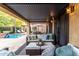 Inviting covered patio with comfortable seating, perfect for relaxing by the sparkling pool at 8737 E San Vicente Dr, Scottsdale, AZ 85258