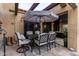 Covered patio with dining set under an umbrella at 8737 E San Vicente Dr, Scottsdale, AZ 85258