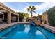 Refreshing pool with elegant water feature, perfect for cooling off on warm days at 8737 E San Vicente Dr, Scottsdale, AZ 85258