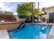 Inviting pool with beautiful tile accents and lounge chairs for relaxing poolside at 8737 E San Vicente Dr, Scottsdale, AZ 85258