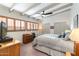Comfortable bedroom with beamed ceilings, wood shutters, and ample closet space at 945 W 10Th St, Mesa, AZ 85201
