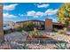 Charming brick home featuring desert landscaping with a covered carport at 945 W 10Th St, Mesa, AZ 85201