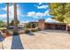 A charming property with desert landscaping and a spacious driveway at 945 W 10Th St, Mesa, AZ 85201