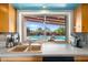 Kitchen window view of the backyard pool, bringing natural light into the home at 945 W 10Th St, Mesa, AZ 85201
